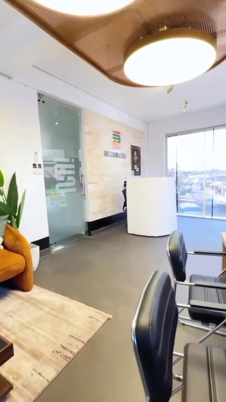 Open-plan IBS Consulting office with timber ceiling