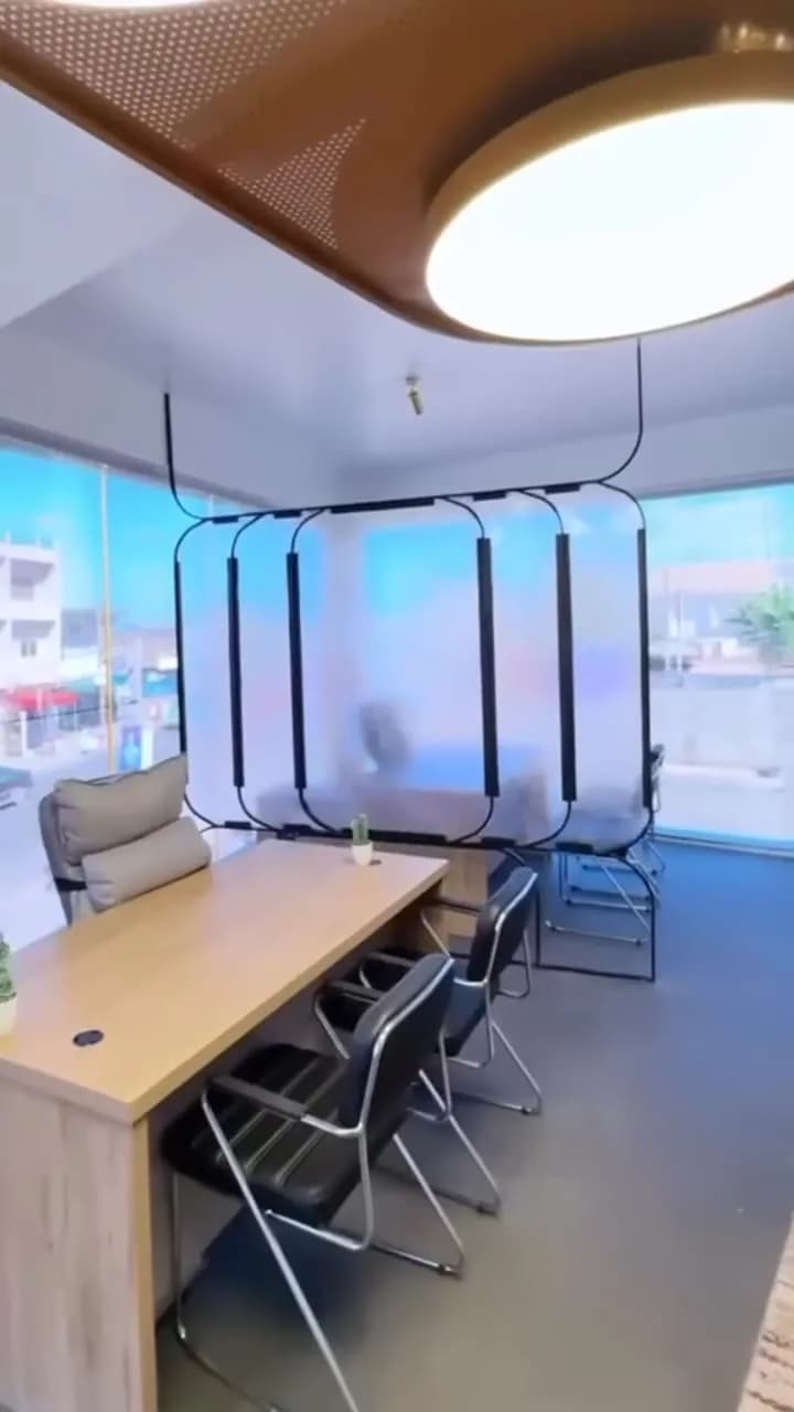 Desks beside frosted glass partitions